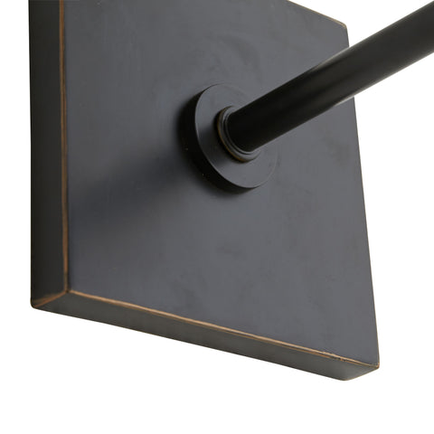 Imani Sconce Base. An antique brass steel pipe gives way to a white linen shade, with bronze details to contrast.
